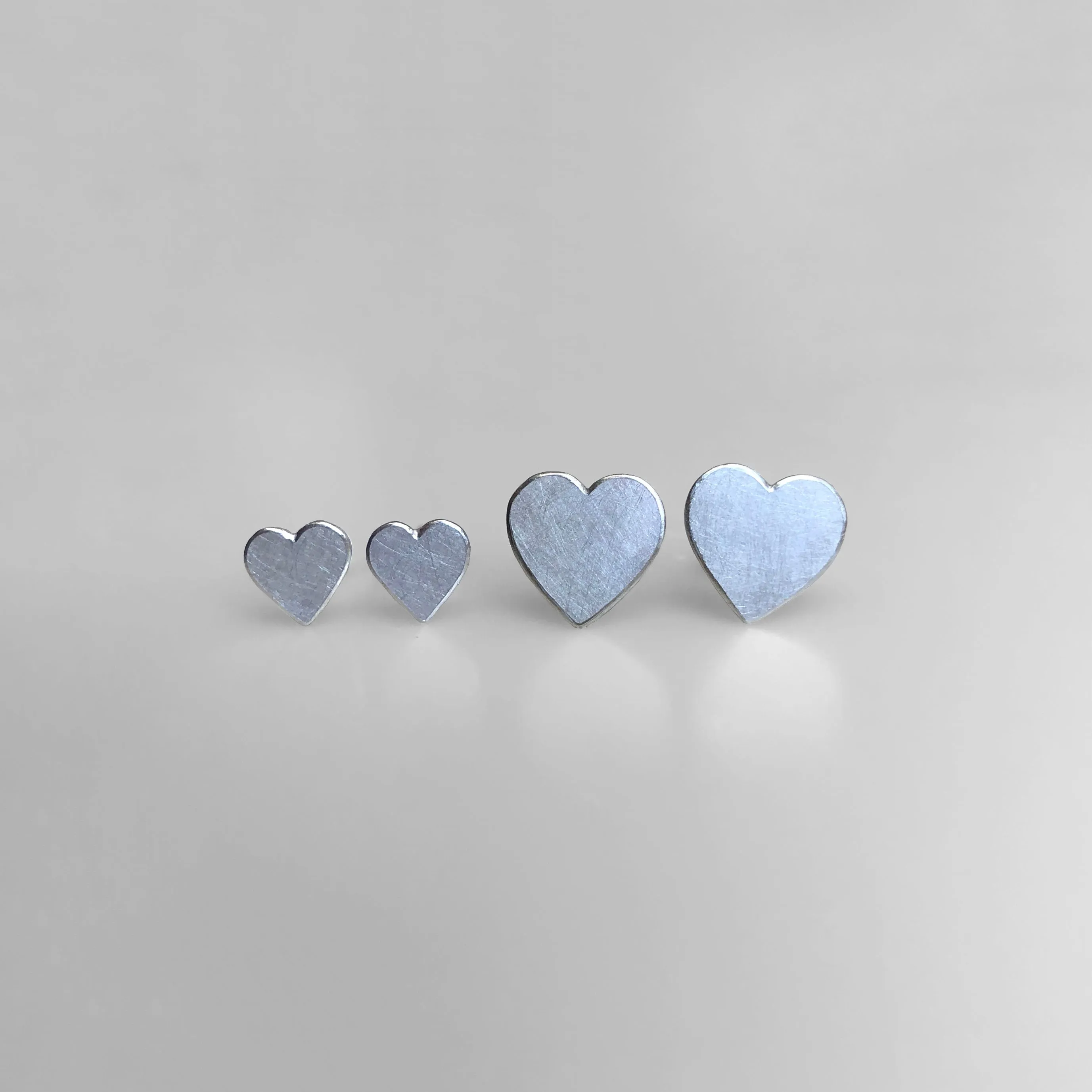 Heart stud earrings in sterling silver, medium