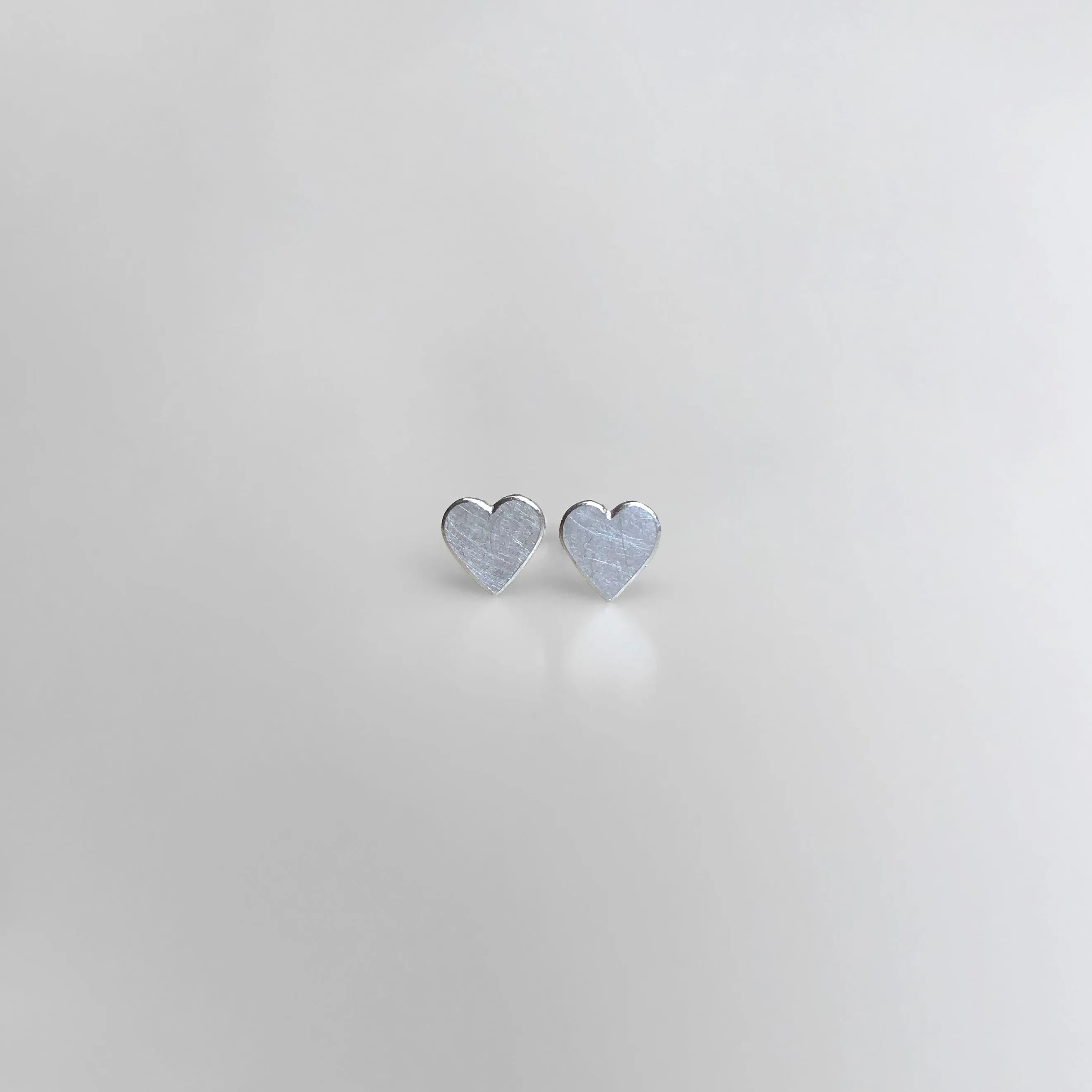 Heart stud earrings in sterling silver, small